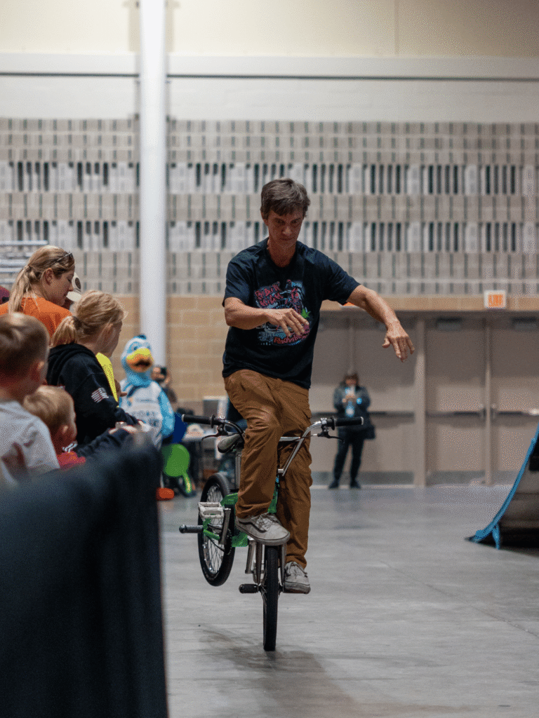 Dave Nourie at OC RV Show performing flatland bmx stunts